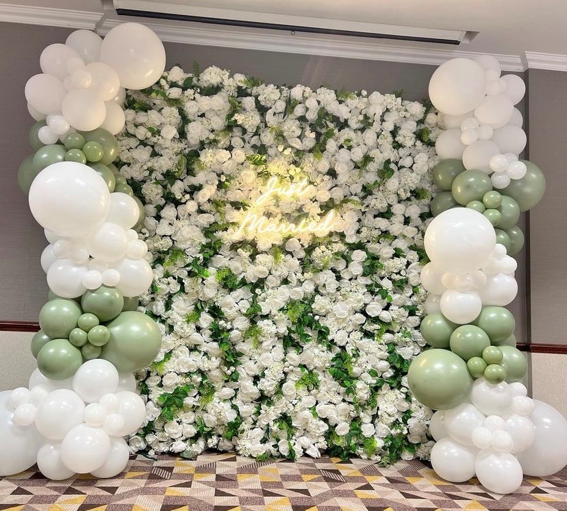 greenery and white rose wall hampshire weddings flower wall